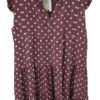 Vestido corto para chica en color negro con estampado de lunares blancos, sin mangas, escote redondo y tejido fluido elástico