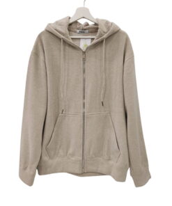 Sudadera beige claro de chico con capucha, cremallera frontal plateada y bolsillos canguro, tejido suave y acabado mezcla de