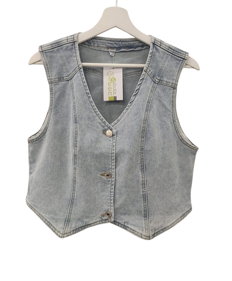 Chaleco vaquero corto para chica en denim azul claro, corte recto sin mangas, con escote en V profundo, botones metálicos y