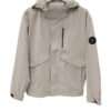 Parka fina de entretiempo beige para chica con capucha ajustable, bolsillos grandes, manga larga y cierre de cremallera bajo