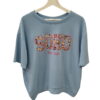 Camiseta de manga corta azul pastel para chica, corte holgado en algodón, con estampado frontal SOHO y flores multicolor, y