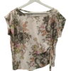 Blusa color crema de manga corta para chica, estampada con flores en tonos verdes, ocres y rosas, corte holgado y nudo decor.