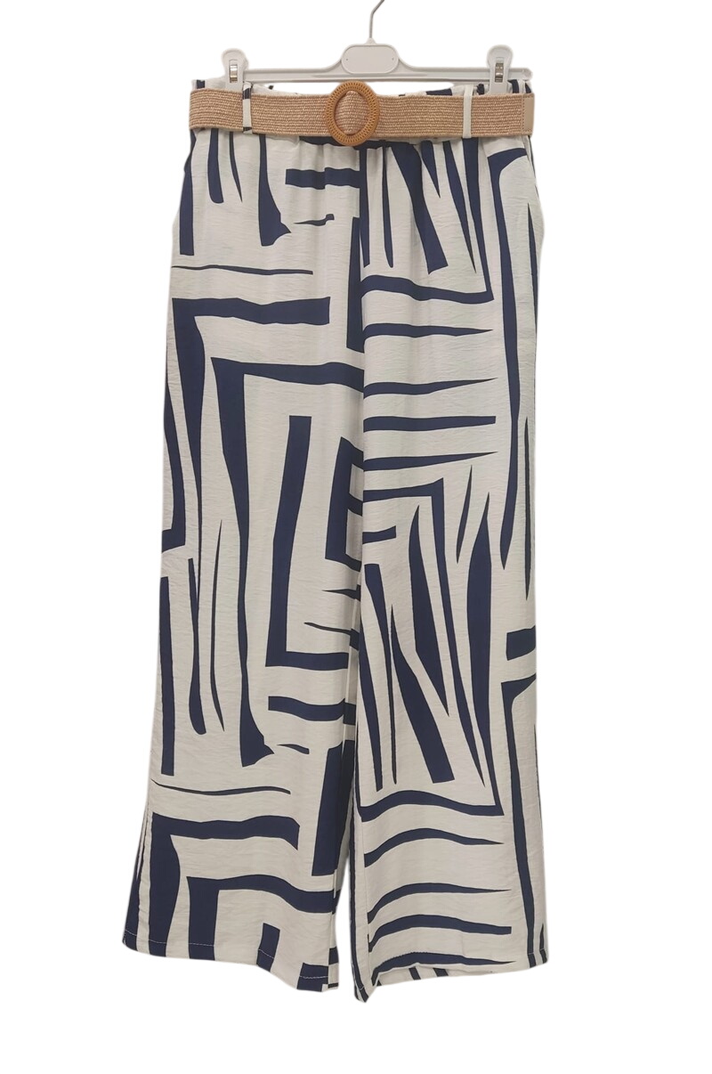 Pantalón flojo largo para chica con estampado asimétrico bicolor en azul marino y blanco, cintura elástica y cinturón trenzad